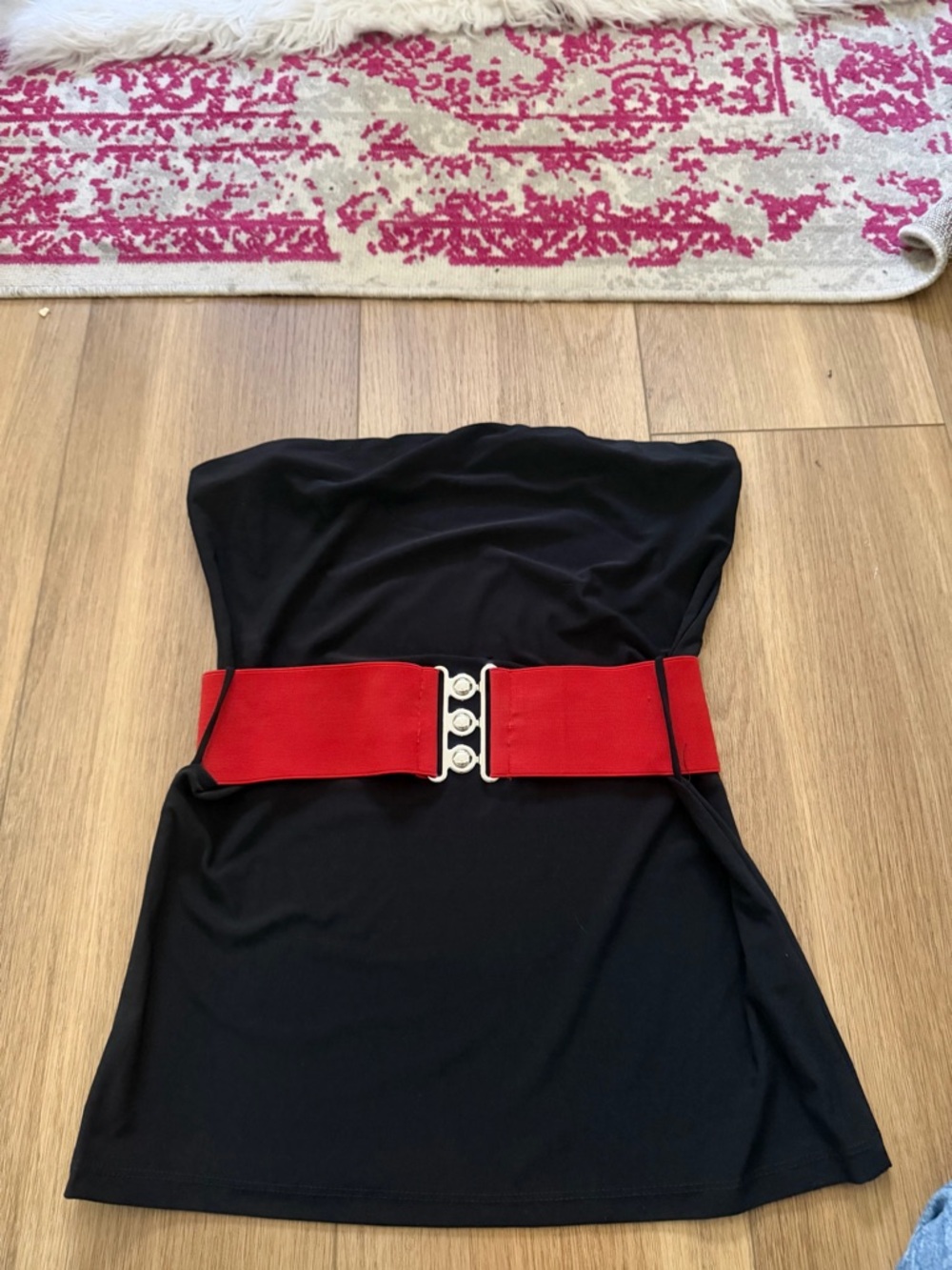 Lipstick Boutique black garment with pink label